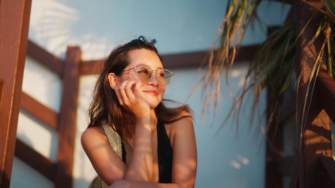 Person looking off to the side in sunlight and shadow