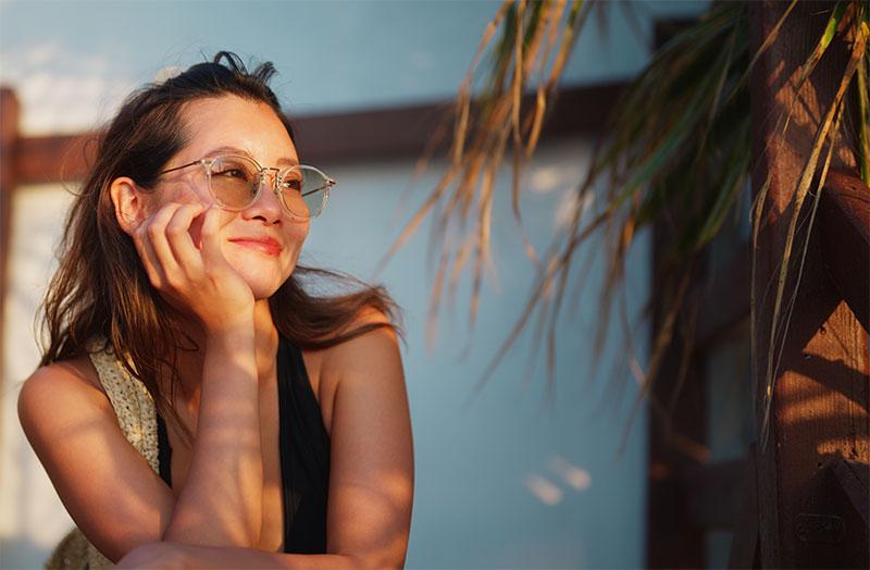 Woman smiling and staring into the distance